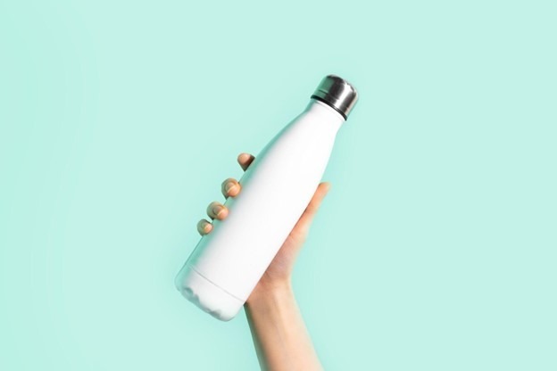 Person holding a reusable bottle