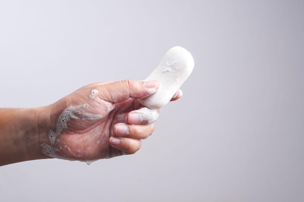 A person holding bar soap