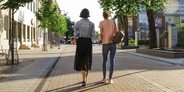 Two people walking together
