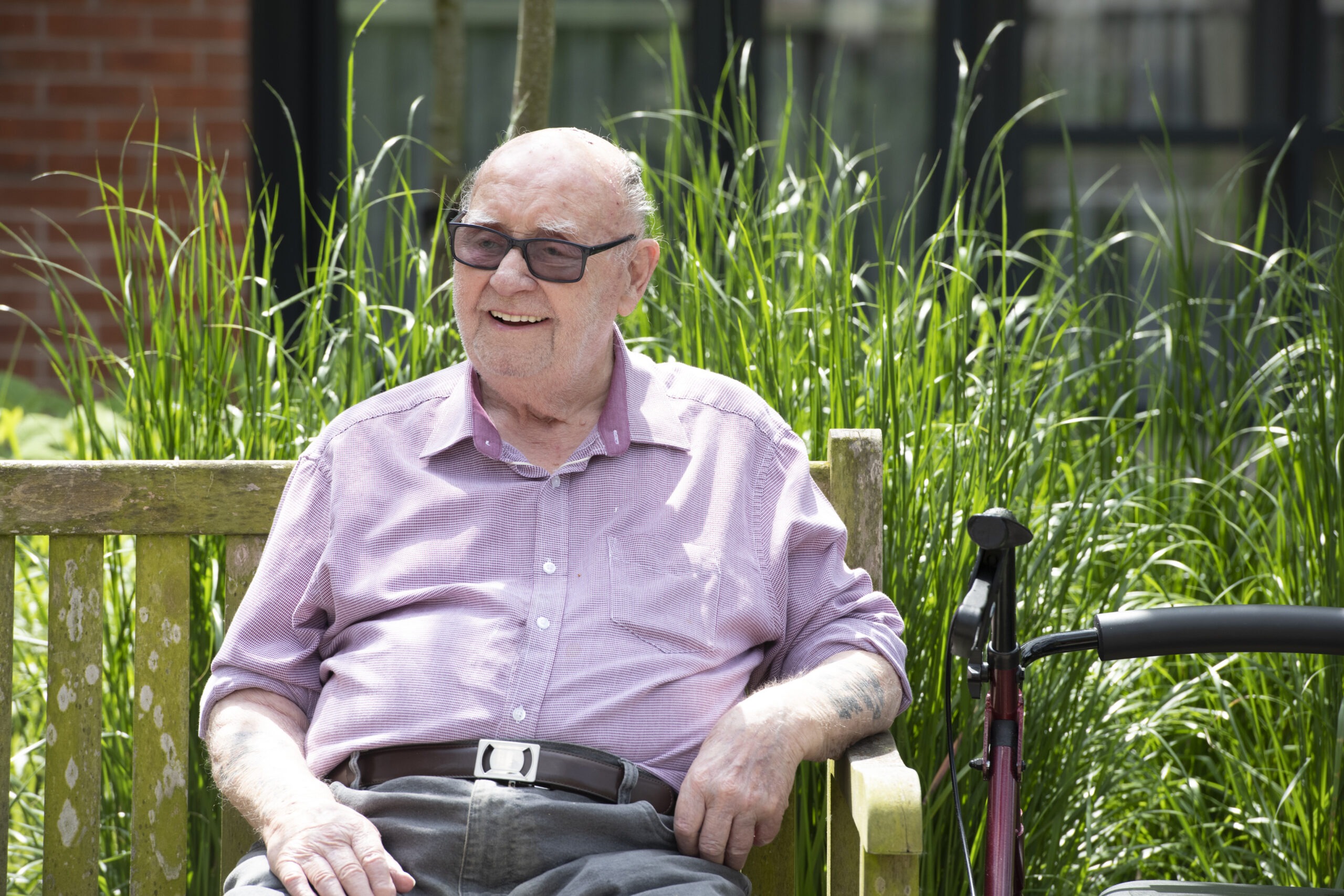 Elderly man sat on a bench