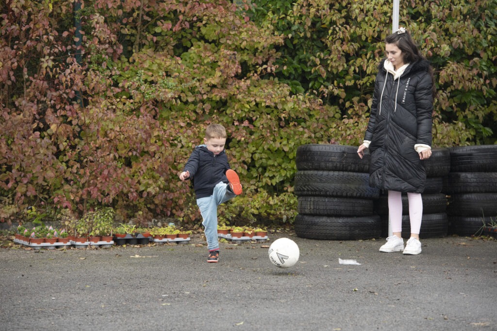 Play streets - Mum and son playing football